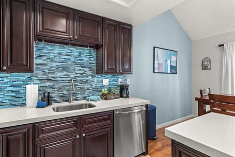 Cook with ease in the fully equipped kitchen featuring all the essentials for a comfortable stay.