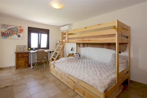 Fourth bedroom with bunk beds (double bed and single bed) and terrace access