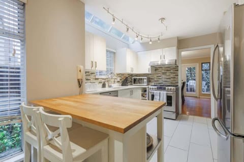 A warm, inviting kitchen bar is perfect for savoring homemade meals or takeout from Greektown's best.