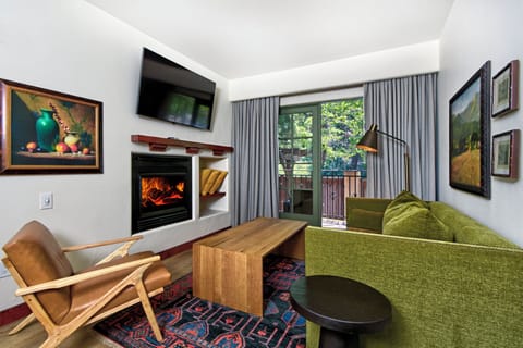 Cozy up by the glowing fireplace after a day out.