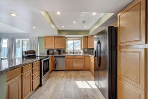 Spacious kitchen with modern appliances, ample counter space, and a seamless flow to the dining area—perfect for preparing meals and gathering with loved ones.