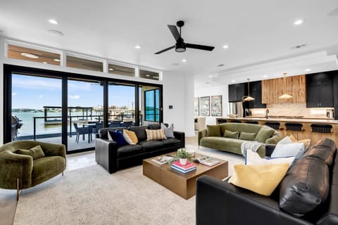 Living area with an abundance of seating options, lake view, and Smart TV