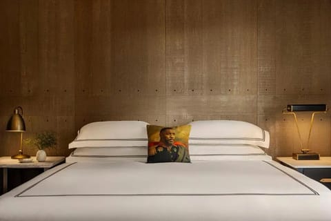 Drift off in a boutique-style bed with warm ambient glow