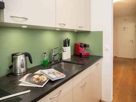 Countertop, Kitchen, Interior Design, Kitchen Appliance, Flooring, Furniture, Kitchen Sink, Cabinetry, Floor, Sink