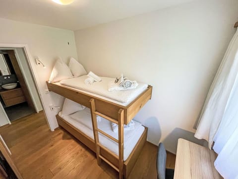 Bed, Bedroom, Furniture, Interior Design, Wall, Bunk Bed, Flooring, Floor, Wood, Bedding