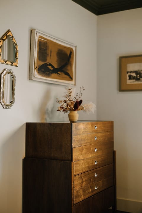 Rest Easy – This cozy green-accented bedroom is perfect for a restful night’s sleep.