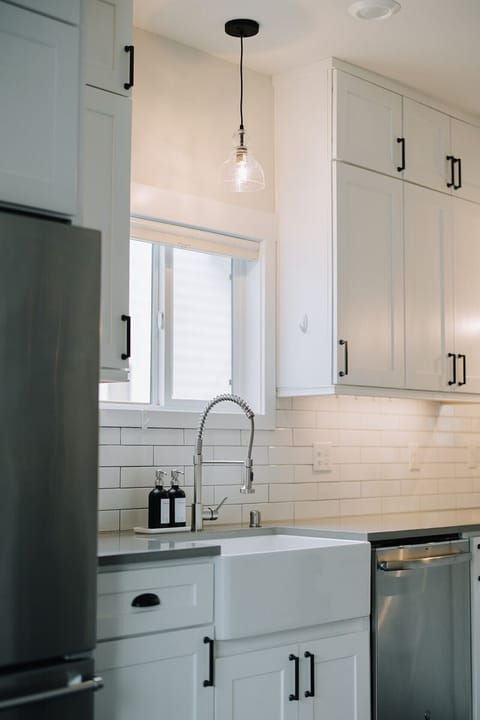 All the Essentials – Full kitchen setup including fridge, stove, oven, microwave, dishwasher & cookware.