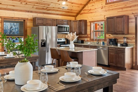 Fully stocked kitchen with granite countertops and everything you need to dine in. (House 1)