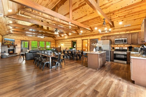 Main living area with ample seating, a fireplace, and large TV for easy relaxation.