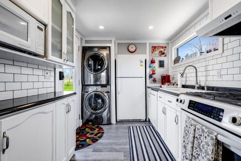 Enter into the highly efficient galley kitchen with all the standard appliances along with a washer and dryer for your convenience.