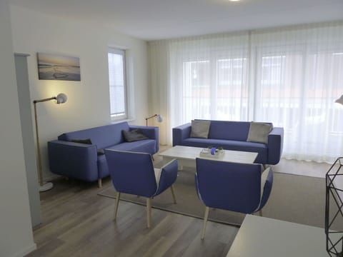 Furniture, Interior Design, Flooring, Floor, Couch, Wood, Apartment, Table, Chair, Living Room