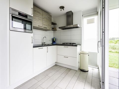 Flooring, Kitchen, Countertop, Cabinetry, Interior Design, Floor, Major Appliance, Kitchen Appliance, Home, Apartment