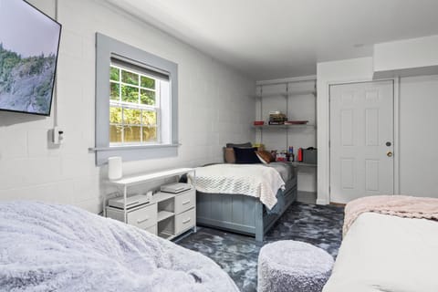 Another view of the bedroom in the basment that include a trundle twin size bed.