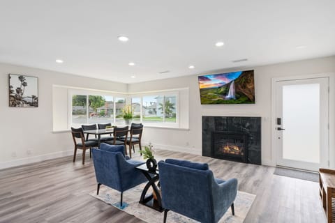 Natural light, modern finishes, and a fireplace create the ideal place to relax.