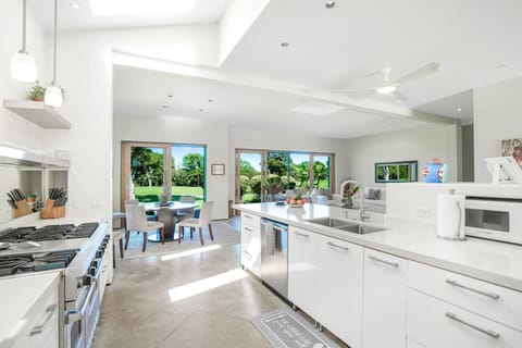 Custom 2 sink design Gourmet kitchen fully stocked dishes, utensils and pantry.