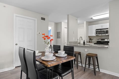 Dine in style - Gather around the modern dining table and toast to good times.