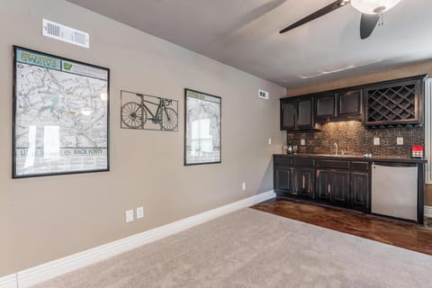 Ping pong, foosball and family game table, plus large TV and wet bar game room