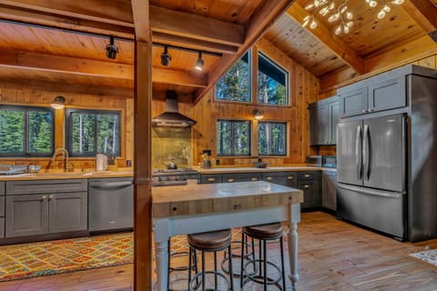 Kitchen: Main floor, drip coffee maker, Keurig, toaster, cooking utensils, tableware