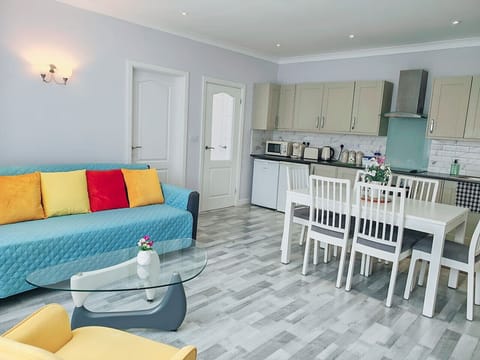 Lounge area leading into dining and kitchen