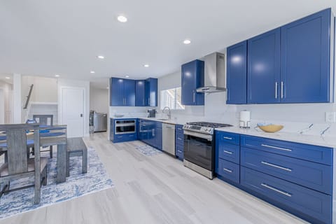 Chef’s Kitchen with High-End Appliances & Marble Counters