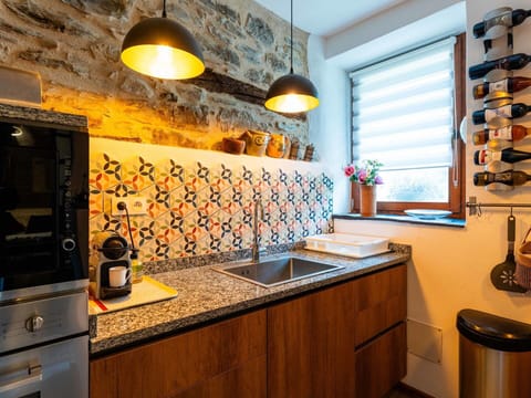 Kitchen, Countertop, Interior Design, Kitchen Appliance, Yellow, Flooring, Lighting, Major Appliance, Cabinetry, Room