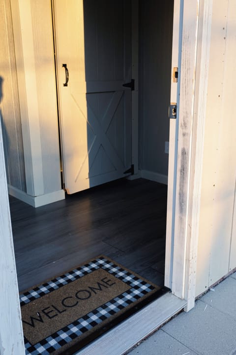 Bathroom one with 2 stalls and a sink