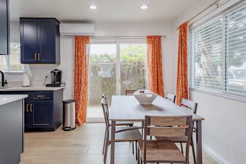 Dining area that can seat up to 6 people with AC, natural light and back yard.