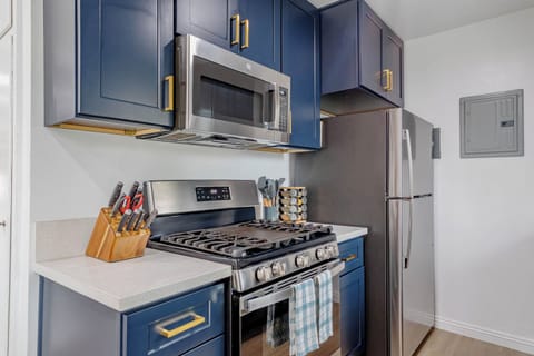 Fully stocked kitchen includes refrigerator, microwave, stove and oven.