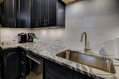 Coffee bar with Keurig and coffee maker.