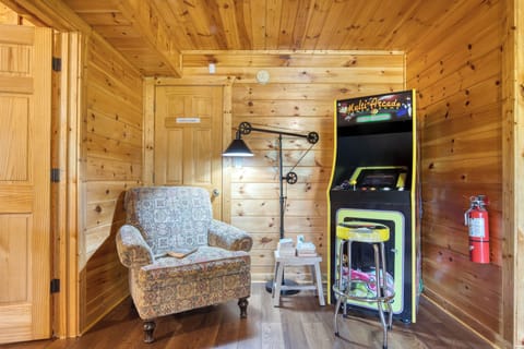 Cozy reading nook near arcade machines.