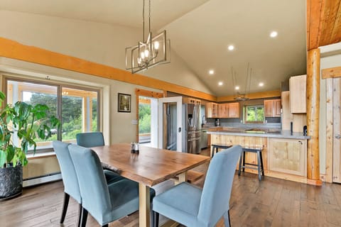 Dining area off the living room leading into a large chefs kitchen
