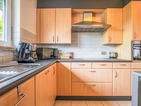 Kitchen, Kitchen Appliance, Cabinetry, Countertop, Major Appliance, Interior Design, Wood, Drawer, Flooring, Furniture