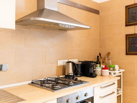 Kitchen Appliance, Kitchen, Countertop, Cabinetry, Kitchen Stove, Major Appliance, Stove, Flooring, Home Appliance, Gas Stove