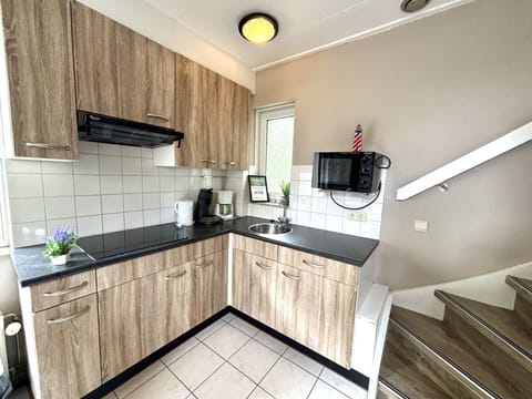 Wood, Flooring, Floor, Interior Design, Kitchen, Furniture, Home, Countertop, Room, Plumbing Fixture