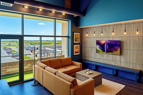 Living Room with Balcony View
Sink into plush comfort with a front-row seat to Sandusky’s skyline—perfect for morning coffee or movie nights with a view of Cedar Point.