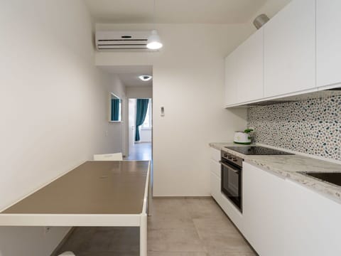 Furniture, Chair, Outdoor Furniture, Table, Outdoor Table, Kitchen & Dining Room Table, Umbrella, Shade, Restaurant, Patio