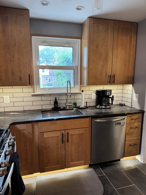 Kitchen with Stainless Steel Appliances and Uplighting