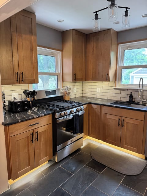 Kitchen with Stainless Steel Appliances and Uplighting