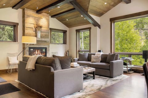 Curl up with a glass of wine by the fireplace in the inviting living room