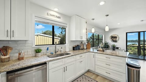 Cooking is a social affair here — the kitchen overlooks the dining area so no one misses a moment.
