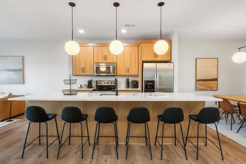 The chic, open kitchen offers ample space & every home comfort