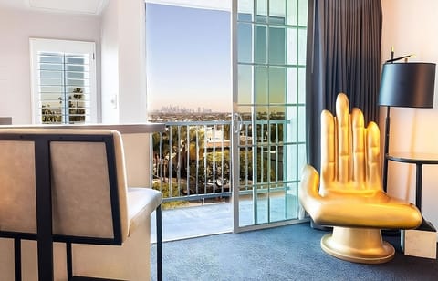 Step onto the balcony and savor skyline views at sunset.