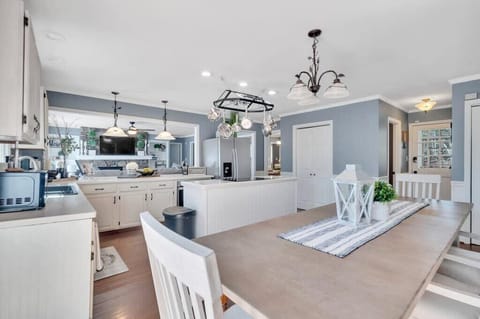A spacious open floor plan seamlessly connects the kitchen and dining area—perfect for cooking, entertaining, and gathering.