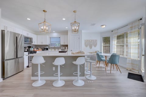 Bright, cheerful, and made for connection—grab a stool, prep a snack, or chat over coffee while sunlight streams through the breakfast nook. The perfect space to start or end your day.
