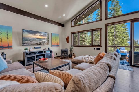 Living room: Second floor, gas fireplace, Smart TV with Apple TV, sectional sofa, deck access