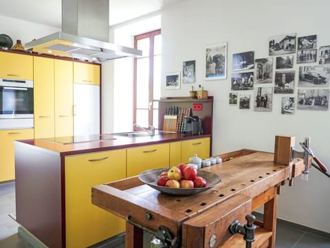 Furniture, Kitchen, Flooring, Interior Design, Wood, Floor, Countertop, Cabinetry, Kitchen Appliance, Ceiling