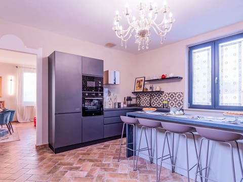 Furniture, Interior Design, Flooring, Kitchen, Floor, Cabinetry, Wood, Countertop, Ceiling, Kitchen Appliance