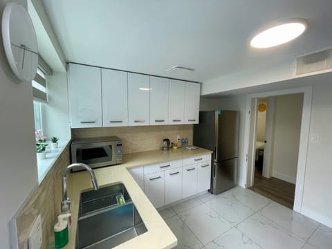 Kitchenette has a microwave, electric kettle and a fridge