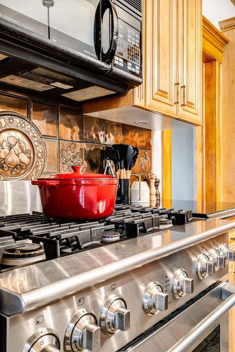 Chestnut cabinetry feels like it could tell recipes of its own.