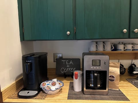 Fully stocked coffee bar w/coffee maker  & bean grinder. Wine & Cocktail Glasses
